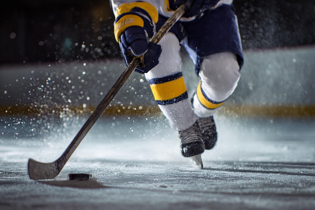 Close view of players in a fast local hockey game